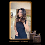 Uma mulher com cabelos brilhantes e penteados, usando um vestido preto sem mangas, está em um ambiente interno. O produto Perfect Liss - Protetor Térmico da Kit Lavatório é exibido abaixo. O texto diz: Resultado usando Perfect Liss - Protetor Térmico.