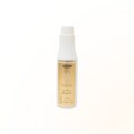 Um frasco branco de revelador em creme PERFECT OX 10V Estabilizada com um rótulo bege e detalhes em dourado é mostrado em um fundo branco liso.
