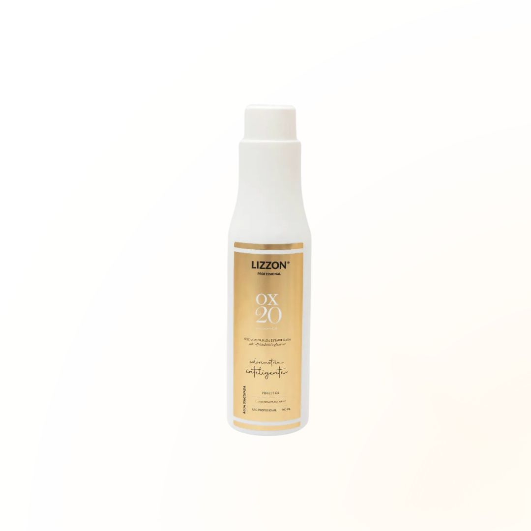 Um frasco plástico branco com o rótulo PERFECT OX 20V Estabilizada Colorimetria Inteligente está na vertical em um fundo branco liso, com um rótulo dourado e branco.