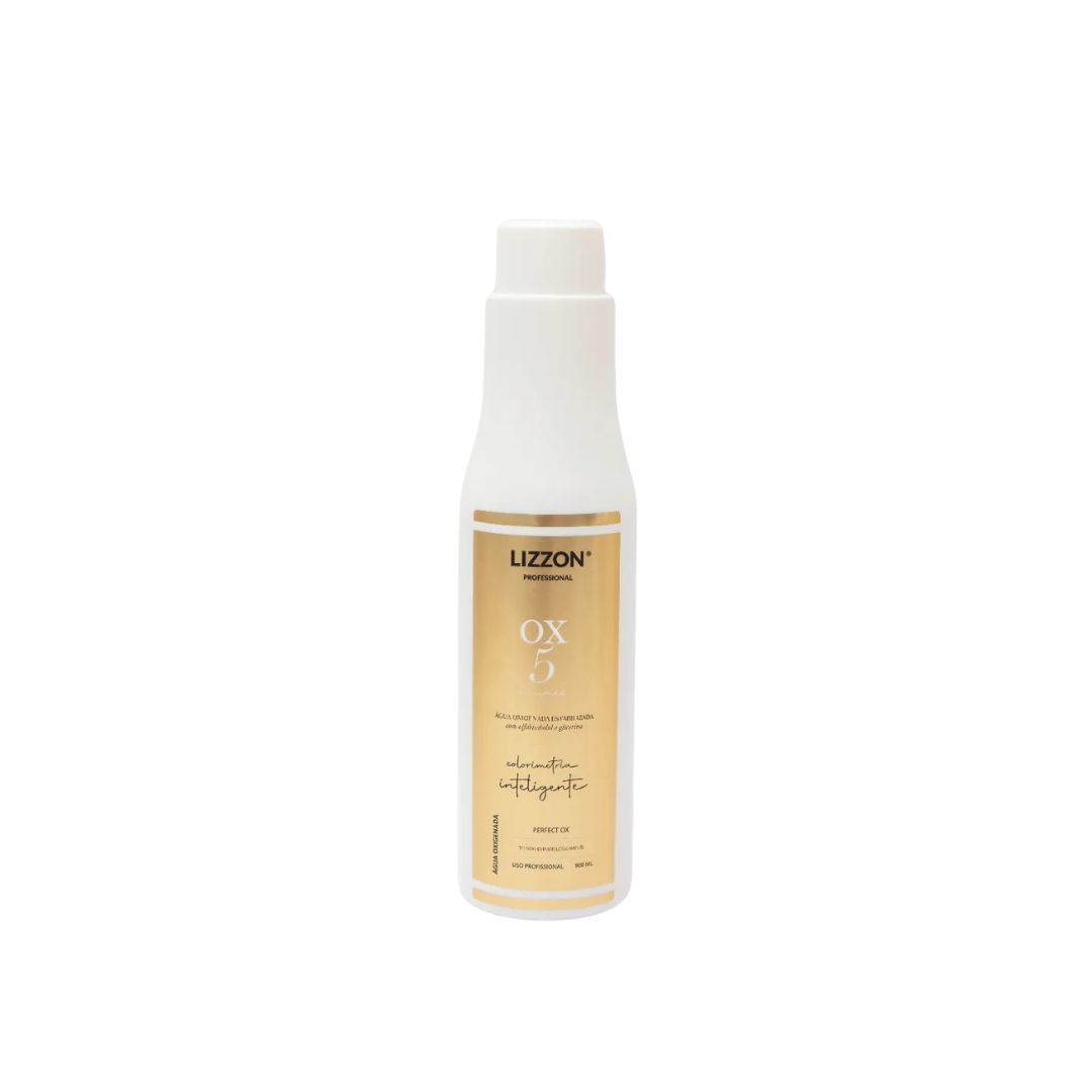 Um frasco plástico branco com um rótulo dourado onde se lê "PERFECT OX 5V Estabilizada Colorimetria Inteligente" e uma tampa branca é mostrado em um fundo branco liso.