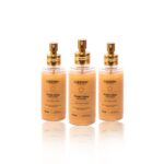Três frascos idênticos de Finish Glow - Perfume e Spray de Brilho (Combo 3 unidades), cada um com um pump dourado e 110 ml, estão dispostos em uma fileira sobre um fundo branco.
