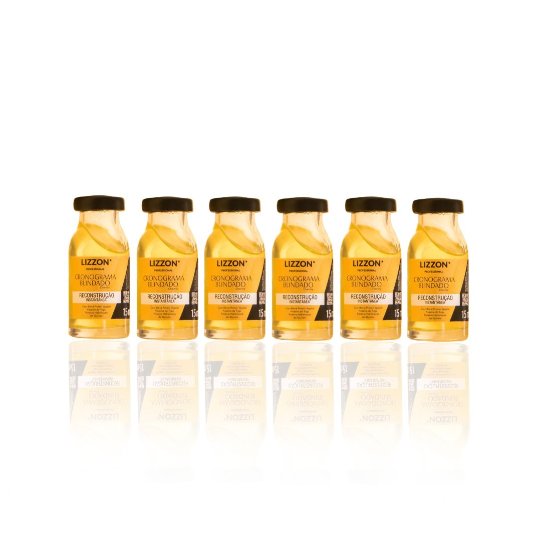 Seis pequenos frascos de vidro transparente contendo líquido amarelo, rotulados como Power Dose Reconstrução (Combo 6 unidades), estão dispostos em linha reta em um fundo branco com seus reflexos espelhados abaixo.